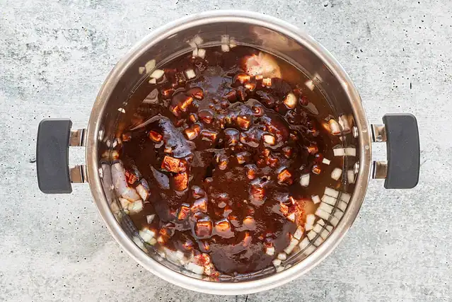 Instant Pot pulled chicken preparation.