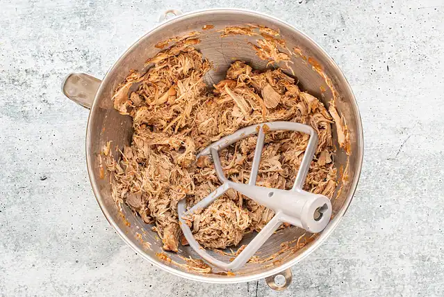 Shredded chicken in the stand mixer.