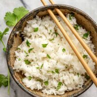 A bowl of Instant Pot rice with a cilantro garnish.