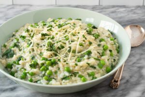 bowl of risotto with spinach and peas