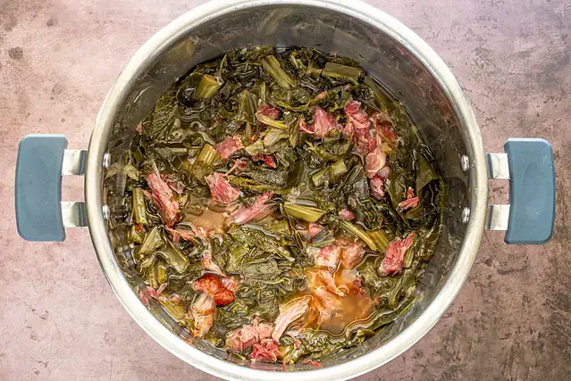 Instant Pot Southern greens and ham hocks cooked and ready to eat.