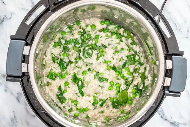Vegetables and Parmesan cheese stirred into the Instant Pot risotto.