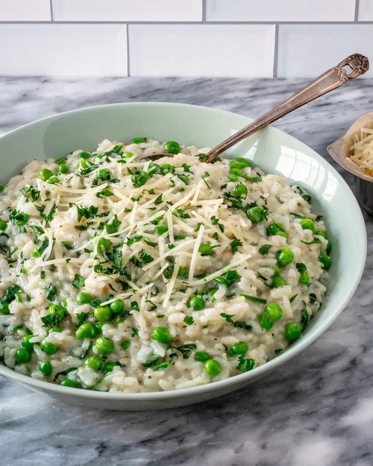 Creamy risotto with green peas and grated cheese.