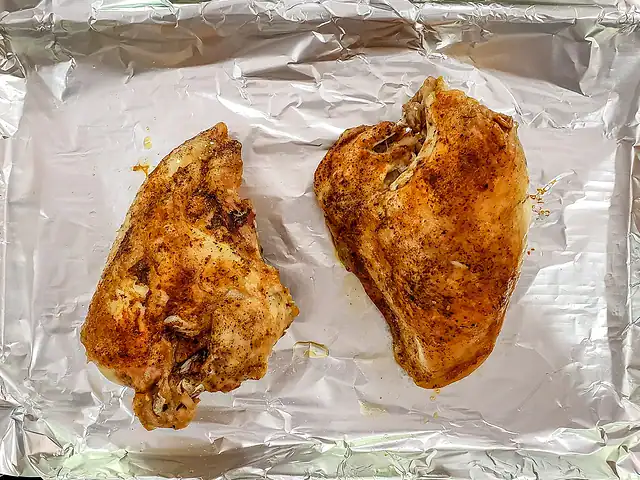 Instant Pot split chicken breasts on a baking sheet, briefly broiled.