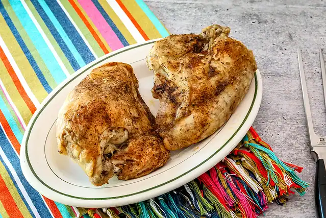 Instant Pot chicken breasts on a serving platter.