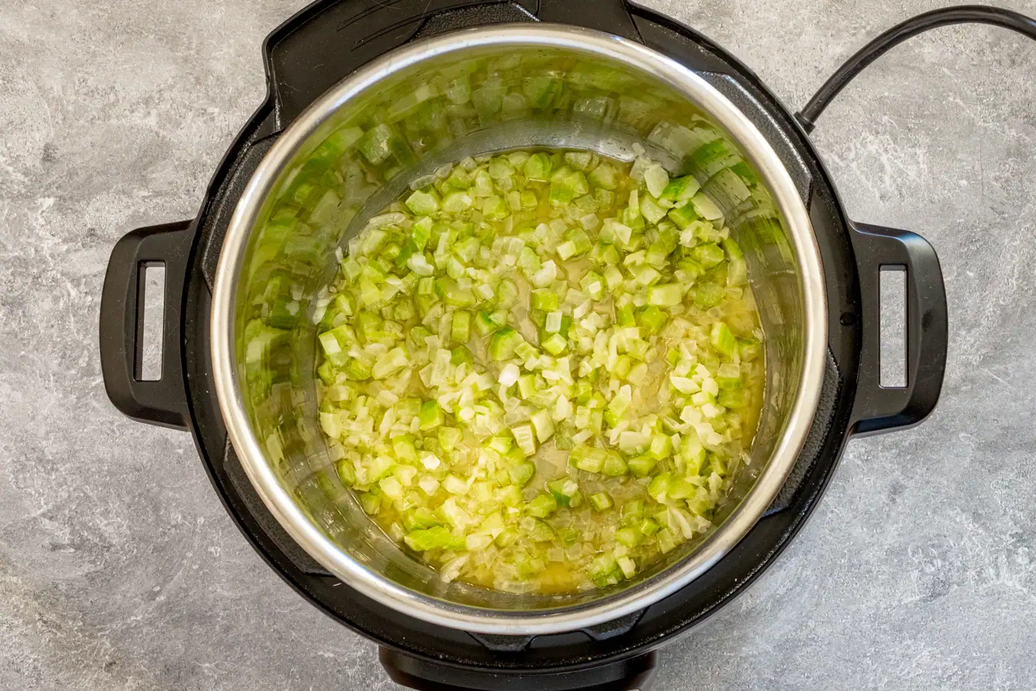Sautéing aromatics for Instant Pot stuffing.