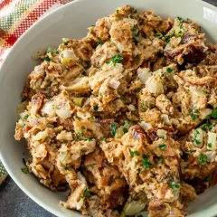 Savory chicken and sausage casserole with herbs and chopped vegetables.