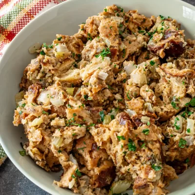 Savory chicken and sausage casserole with herbs and chopped vegetables.