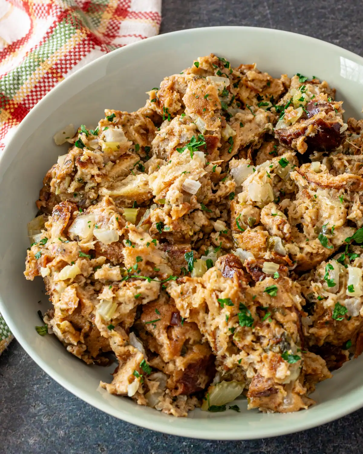 Savory chicken and sausage casserole with herbs and chopped vegetables.