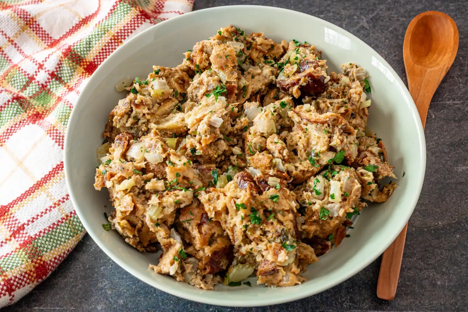 
A serving bowl with Instant Pot cooked stuffing, made with challah bread.