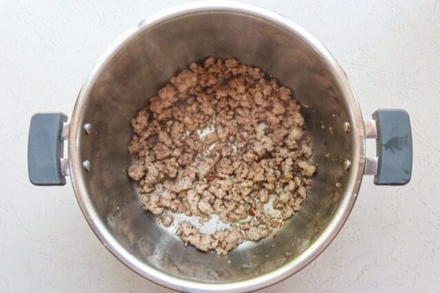 Cooking the sausage for zuppa Toscana.