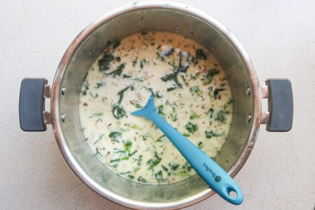 Finishing Instant Pot zuppa Toscana with cream.