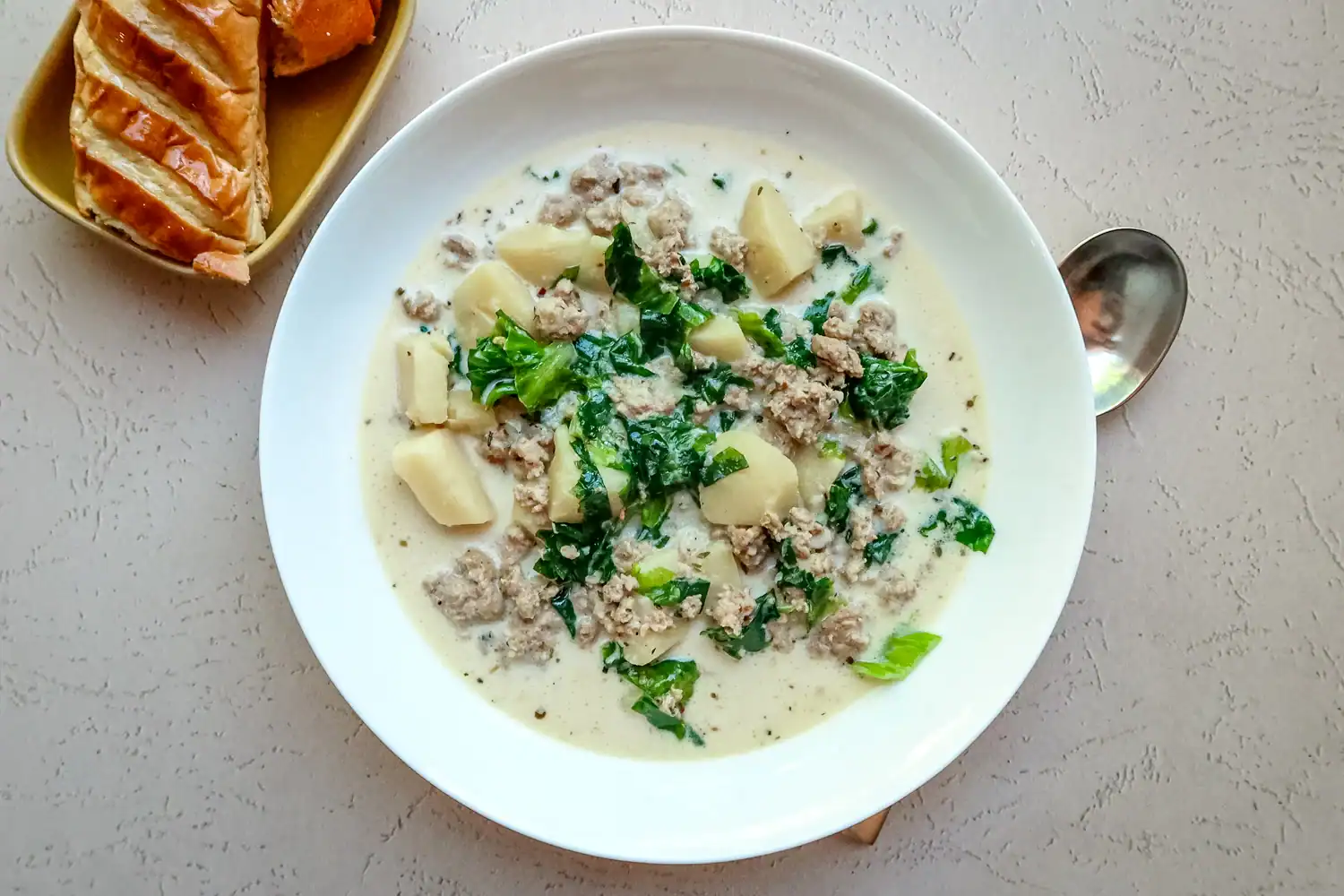 Instant Pot zuppa Toscana with excarole, sausage, potatoes, and Parmesan cheese.