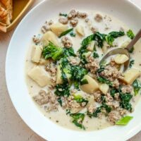 A bowl of Instant Pot zuppa Toscana, potato and sausage soup.