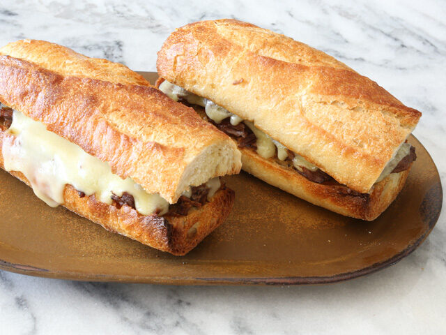 italian beef sandwiches with melted provolone cheese