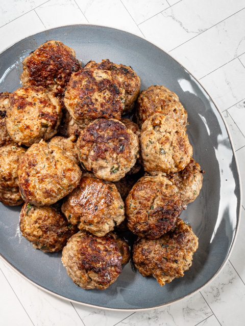 A serving plate with Italian meatballs.