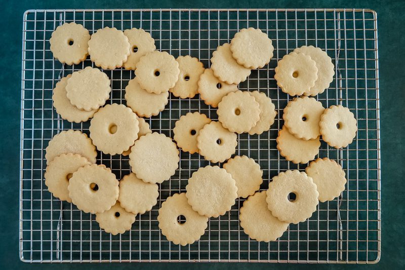 unfilled jammie dodger cookies on a cooling rack