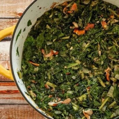 dutch oven with a mess of kale and mustard greens with bacon