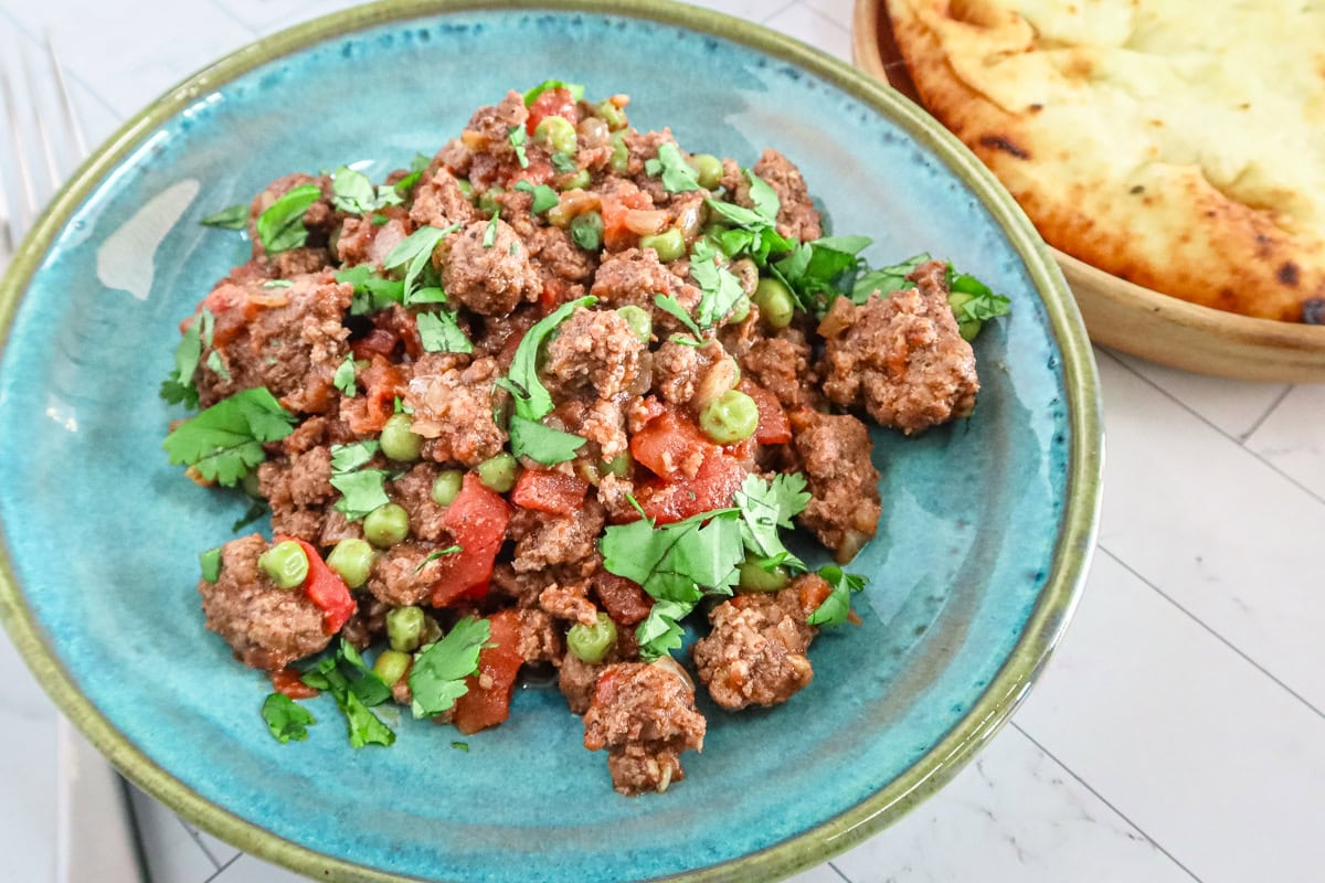 Keema matar with naan bread on the side.