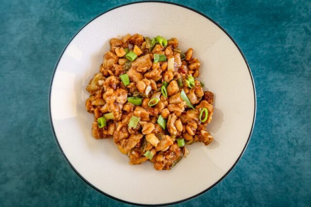 stir-fried kung pao chicken in a bowl