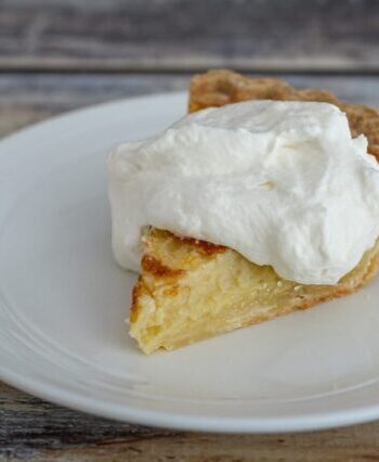 a lemon buttermilk pie with whipped cream