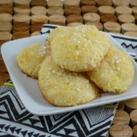 Soft lemon tea cake cookies on a small plate.