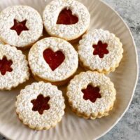 Linzer cookies on a plate.