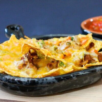 loaded nachos in a luncheon plate