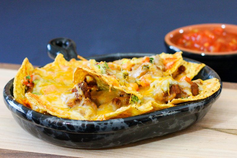 loaded nachos in a luncheon plate
