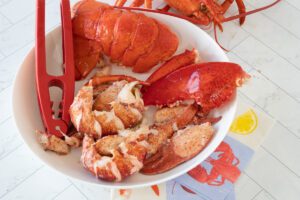 cooked lobster meat with shells on the side