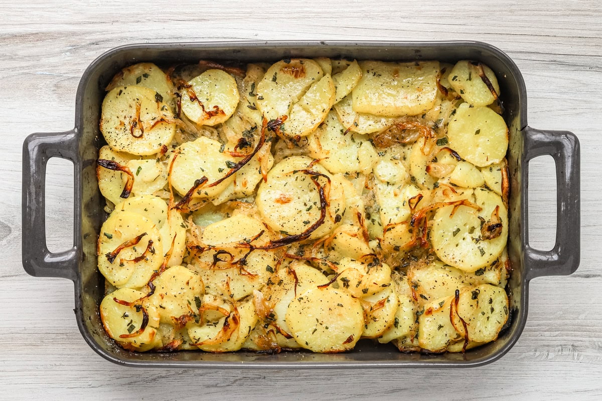 The baked Lyonnaise potatoes are in ready to scoop and serve.
