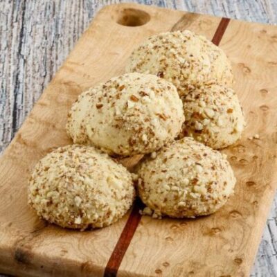 macadamia nut cookies on a small cutting board
