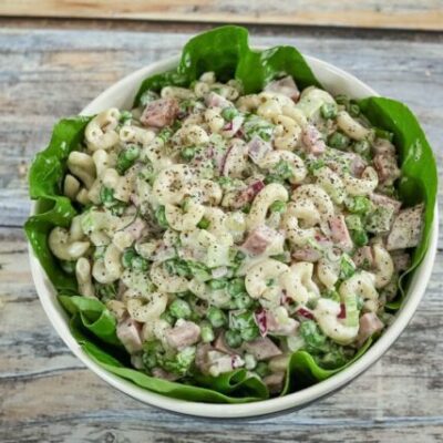 macaroni salad with ham in a serving bowl