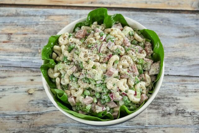 macaroni salad with ham in a serving bowl