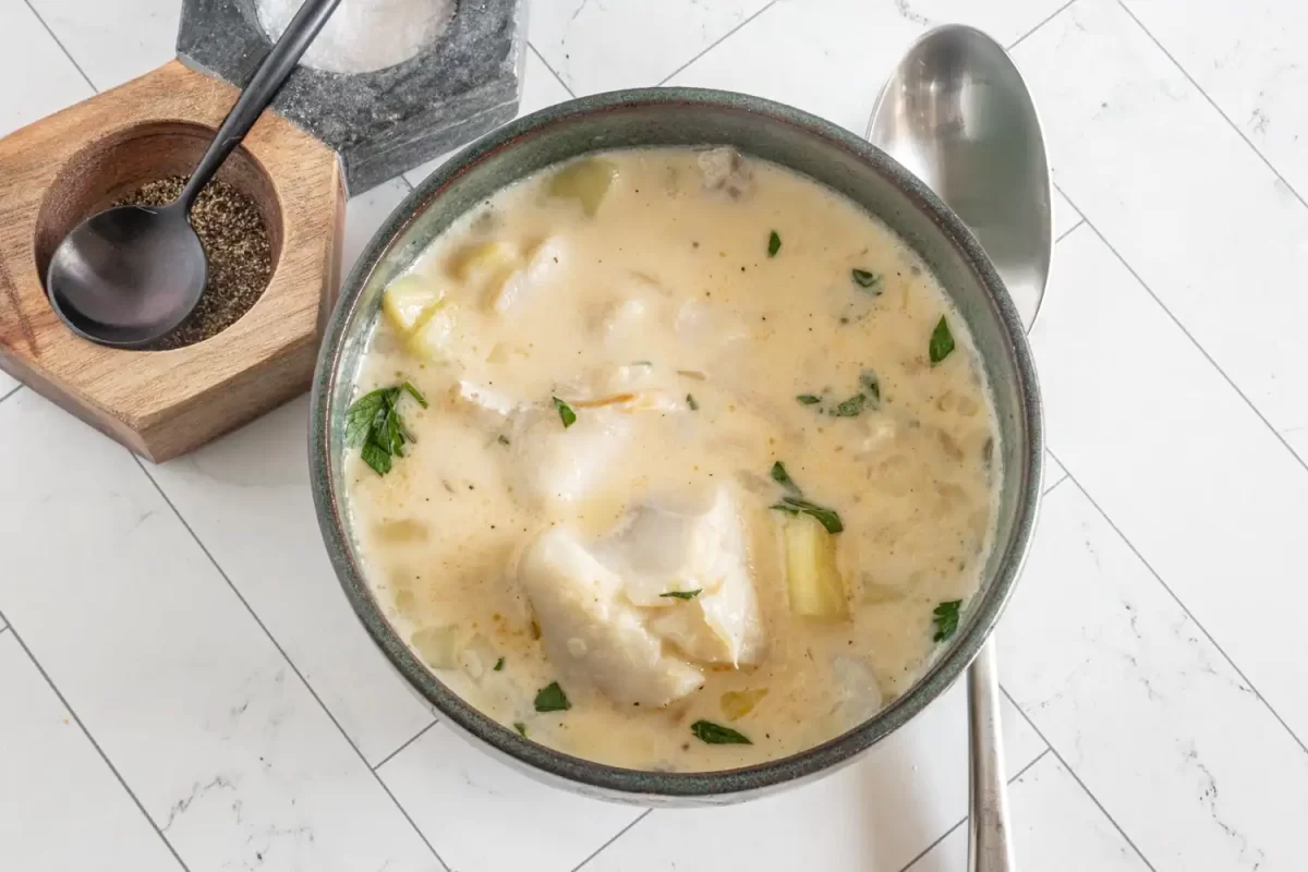Creamy fish soup with herbs.