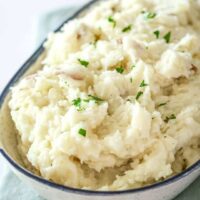 Creamy mashed potatoes with fresh herbs.