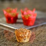 maple bacon muffin with crunchy topping and more on a cooling rack