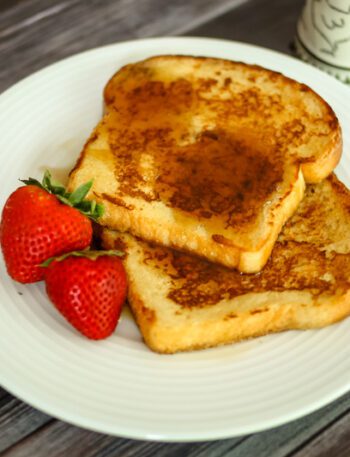 maple cinnamon french toast on a plate with strawberries
