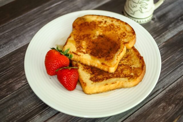 maple cinnamon french toast on a plate with strawberries