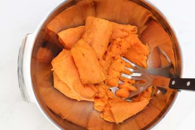 mashing sweet potatoes