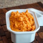 maple mashed sweet potatoes in a serving dish.