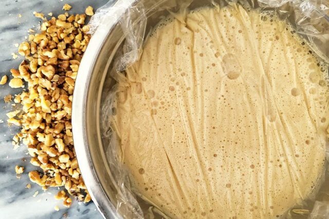 ice crem mixture in a bowl to chill with some walnuts on the side