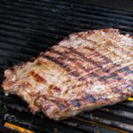 marinated flank steak on the grill