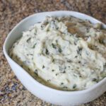 mashed potatoes with kale in a serving bowl