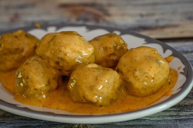 spicy tex-mex meatballs with cheese sauce on a plate