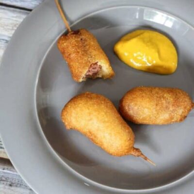 mini corn dogs and yellow mustard