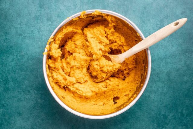 Mashed sweet potatoes in a bowl.