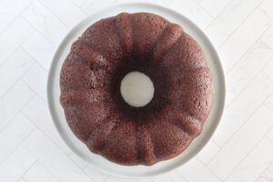 Moist chocolate Bundt cake on the cake plate.