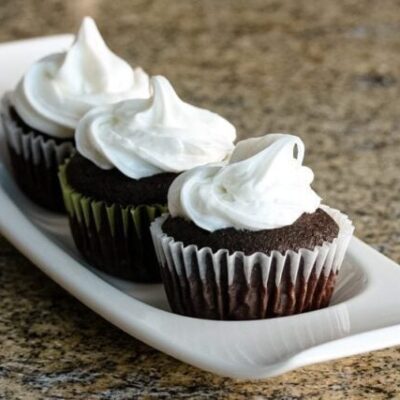 Moist chocolate cupcakes on a serving tray.