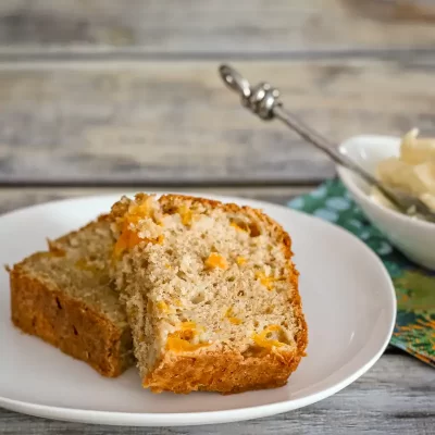 Sweet banana bread with chunks of orange zest.